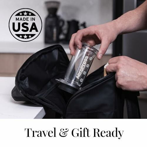 Person packing an Aeropress coffee maker into a travel bag.