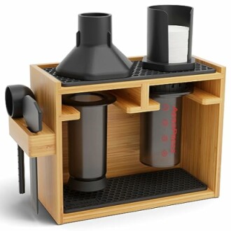 Bamboo organizer for AeroPress coffee maker with accessories.