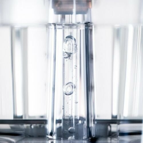 Close-up of water droplets in a clear container