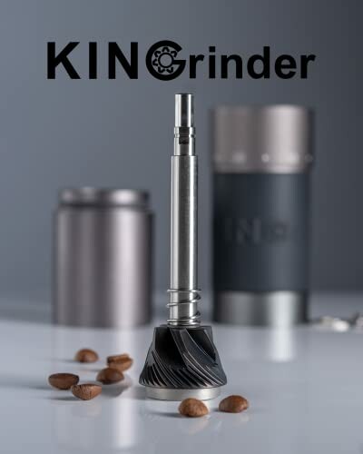 Coffee grinder burr with scattered beans and blurred background.