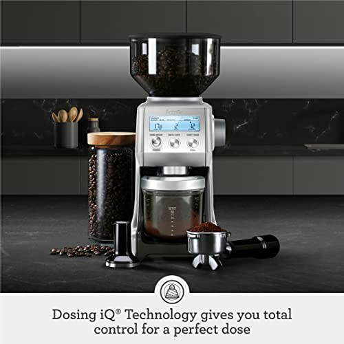 Coffee grinder machine with dosing technology and coffee beans.