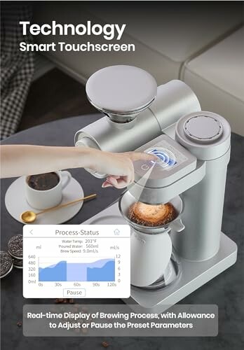 Person using smart touchscreen on coffee maker with brewing status display.